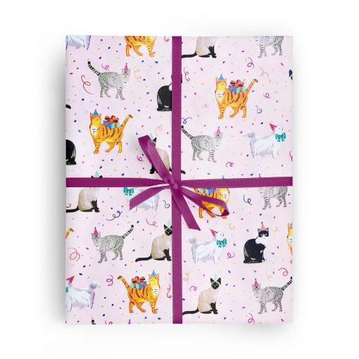 Flat box wrapped in gift wrap pattern of whimsical kitties in party hats are surrounded by falling confetti on a pretty pink background.