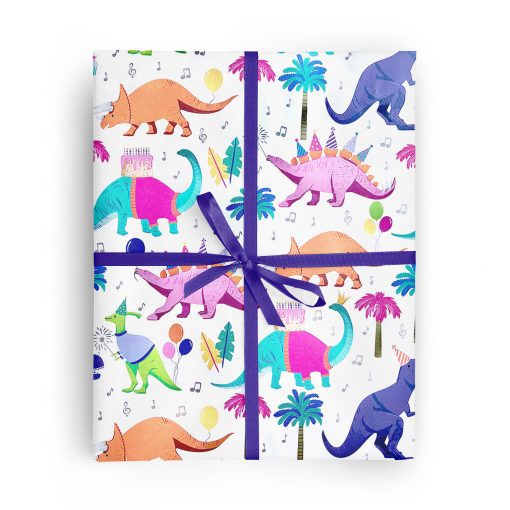 Flat box wrapped in gift wrap pattern of sweet dinosaurs including T-Rex, stegosaurus and triceratops party with birthday cakes and balloons.