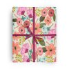 Flat box wrapped in gift wrap pattern of beautiful and feminine flowers in a romantic pastel color palette.