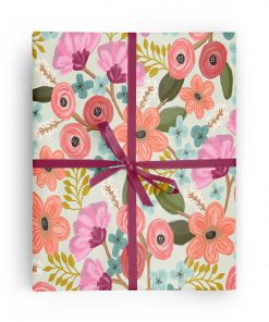 Flat box wrapped in gift wrap pattern of beautiful and feminine flowers in a romantic pastel color palette.