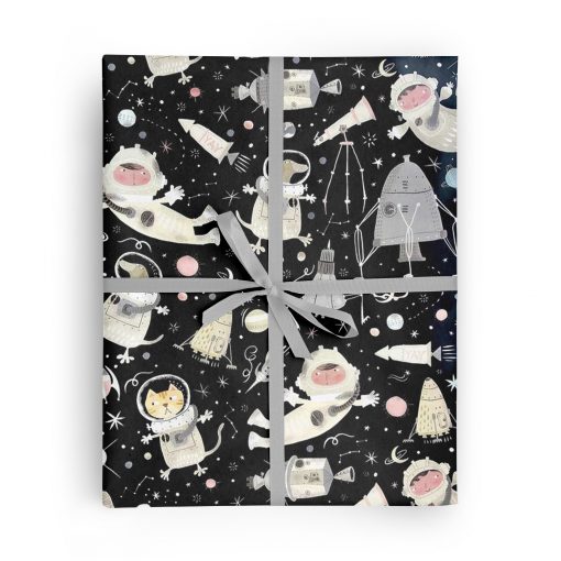 Flat box wrapped in gift wrap pattern including a boy, cat, and dog in space suits, floating through outer space with rockets, space ships, planets, and stars.